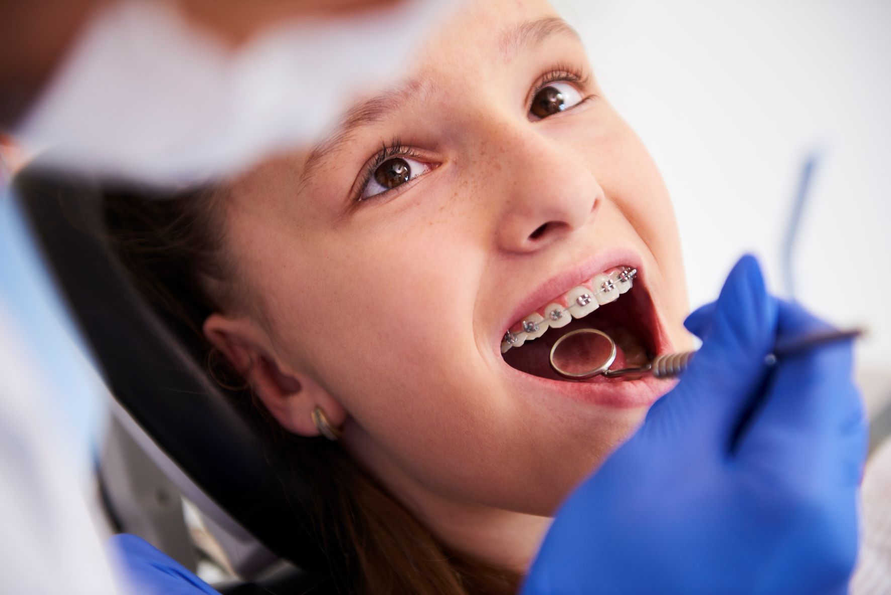 23 girl-with-braces-during-routine-dental-examination.jpg